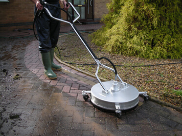 Driveway being cleaned with special equipment